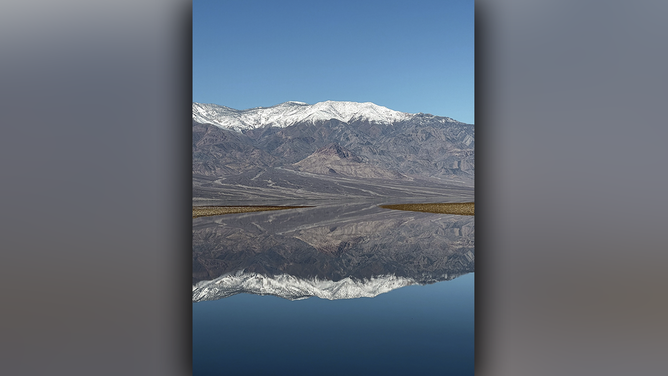 Lake Manly on February 12, 2024 reflecting mountains.