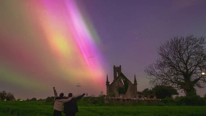 This incredible image shows the sky filled with colors of pink, red, purple and green as the Northern Lights danced above a church in Ireland on Saturday, May 11, 2024.