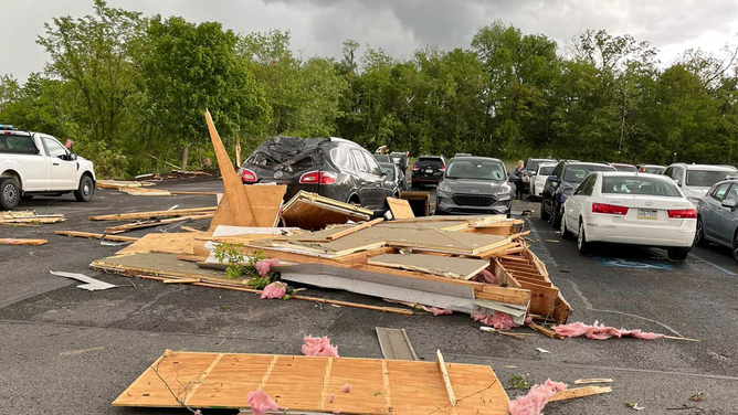 Debris is seen in the parking lot of a church that was damaged by a tornado in Finleyville, Pennsylvania, on Saturday, May 11, 2024.