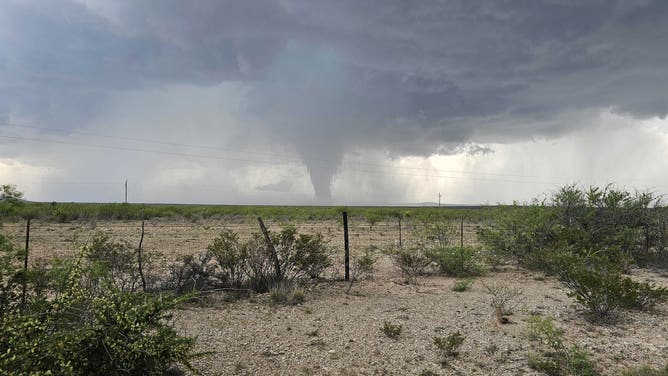A likely tornado is spotted just south of Fort Stockton, Texas, on Saturday, May 4, 2024.