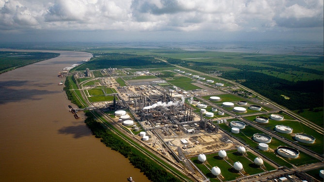 The ConocoPhillips Alliance Refinery stands along the Mississippi River outside outside Belle Chase, Louisiana, U.S., on Saturday, July 3, 2010.