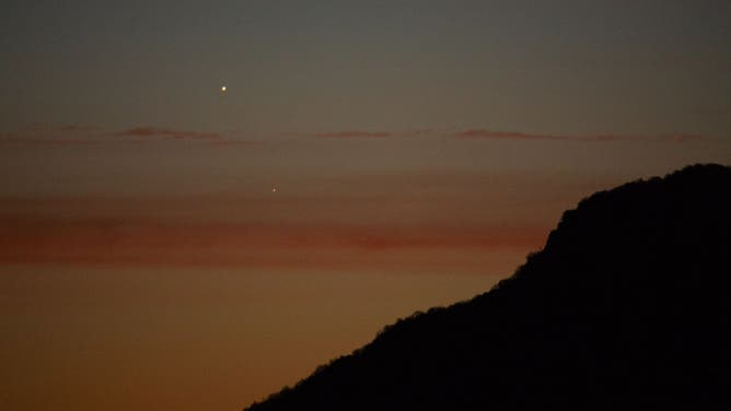 Venus and Mars planets in conjunction before sunrise are seen from L'Aquila, Italy, on February 22nd, 2024. 