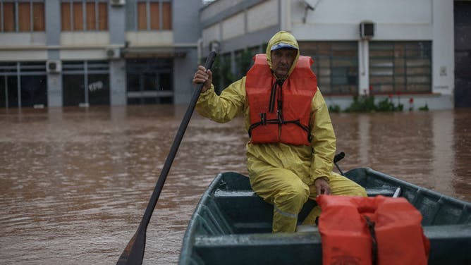 Volunteer Anilto Alvares da Silva, know as Nico, prepares to search for residents trapped inside their houses at the Quilombo neighborhood in Sao Sebastiao do Cai, Rio Grande do Sul state, Brazil on May 2, 2024.