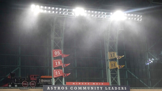 Rain blows in from the windows as a severe thunderstorm hit before a baseball game between the Oakland Athletics and the Houston Astros at Minute Maid Park on Thursday, May 16, 2024, in Houston.