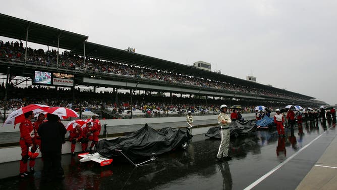 FILE - INDIANAPOLIS - MAY 27: Cars sit in pit lane during a rain delay at the IRL IndyCar Series 91st running of the Indianapolis 500 at the Indianapolis Motor Speedway on May 27, 2007 in Indianapolis, Indiana. (Photo by Darrell Ingham/Getty Images)