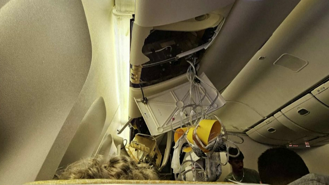 This photo shows oxygen masks that feel during severe turbulence on board a Singapore Airlines flight on Monday, May 20, 2024.