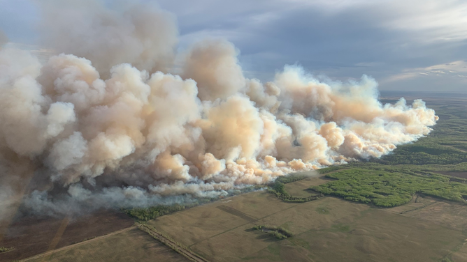 Alberta Wildfire crews battling a fire in the Grande Prairie Forest Area