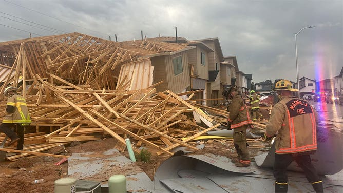 Firefighters investigate the collapse of homes in Magnolia, Texas, that happened during storms May 28, 2024.