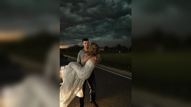 Newlyweds Trapper and MaKayla Shore took epic wedding photos as a thunderstorm approached.