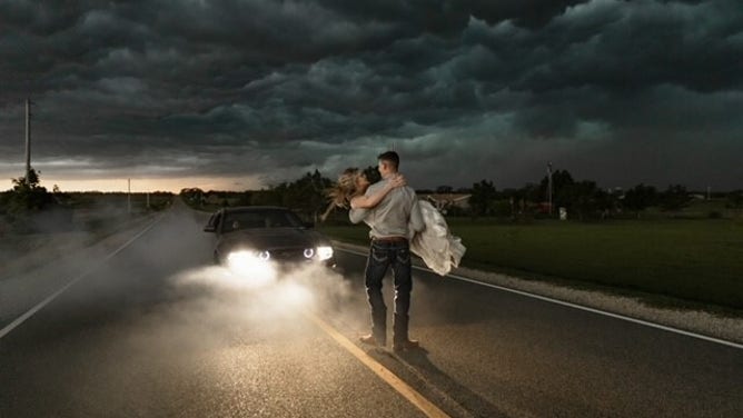 Newlyweds Trapper and MaKayla Shore took epic wedding photos as a thunderstorm approached.