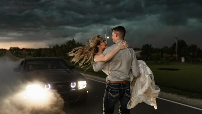 Newlyweds Trapper and MaKayla Shore took epic wedding photos as a thunderstorm approached.