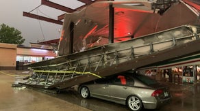 Florida thunderstorm knocks gas station canopy onto car near Orlando