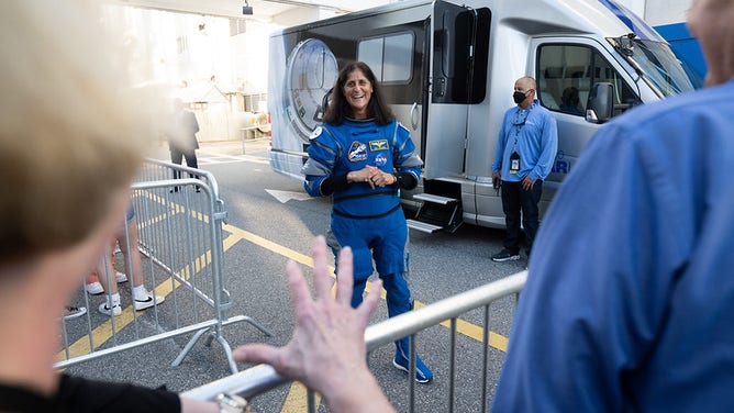 NASA astronaut Suni Williams, wearing a Boeing spacesuit, speaks with NASA Deputy Administrator Pam Melroy and NASA Administrator Bill Nelson as she prepares to depart the Neil A. Armstrong Operations and Checkout Building with fellow crewmate NASA astronaut Butch Wilmore for Launch Complex 41 on Cape Canaveral Space Force Station to board the Boeing CST-100 Starliner spacecraft for the Crew Flight Test launch, Wednesday, June 5, 2024, at NASA’s Kennedy Space Center in Florida.