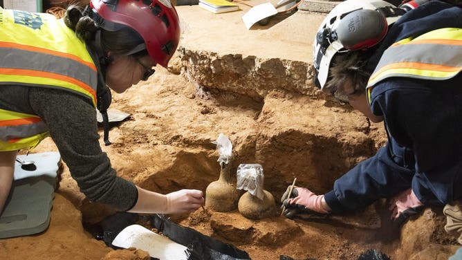 Archaeologists at George Washington’s Mount Vernon have unearthed 37 glass bottles from the 18th century in five storage pits in the Mansion cellar of the nation’s first president.