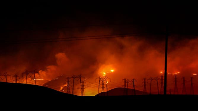 A view of transmission towers in flames as Corral Fire continue in San Joaquin County, California, United States on June 2, 2024.