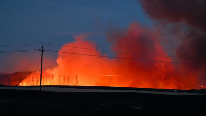 A view of transmission towers in flames as Corral Fire continue in San Joaquin County, California, United States on June 2, 2024.