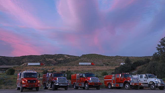 Engine crews are positioned off I-5 Interstate highway for for the "Post Fire" in Gorman, California, on June 17 2024.