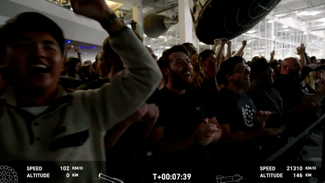 SpaceX employees at the company's headquarters in California cheer after the Super Heavy booster lands in the Gulf of Mexico during the fourth flight test of Starship on June 6, 2024.