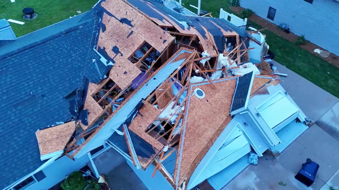 Storm damage to a home after a tornado-warned storm moved through Janesville, Wisconsin on Saturday, June, 22, 2024.