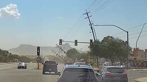 Watch: Drivers swerve as winds topple power lines in Arizona