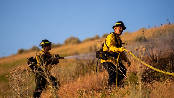 Firefighters work to extinguish the Sandhurst Fire outside Sale Lake City on Saturday, July 20, 2024.