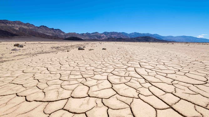 Landscape in Death Valley National Park, California, USA. The earth is cracked and dried out by the sun.