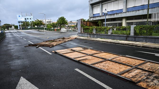 Billboards are seen fallen on the street as hurricane Beryl passes near to Bridgetown, Barbados on July 1, 2024. Hurricane Beryl plowed toward the southeast Caribbean early Monday as officials warned residents to seek shelter ahead of powerful winds and swells expected from the Category 3 storm. (Photo by CHANDAN KHANNA / AFP) (Photo by CHANDAN KHANNA/AFP via Getty Images)