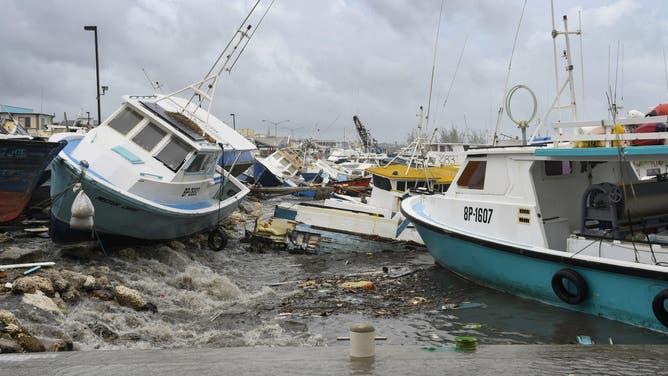 Damaged fishing boats rest on the shore after the passing of Hurricane Beryl at the Bridgetown Fish Market, Bridgetown, Barbados on July 1, 2024. (Photo by Randy Brooks / AFP) (Photo by RANDY BROOKS/AFP via Getty Images)
