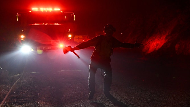 A firefighter is in action as Thompson Fire of wildfires continue in Oroville of Butte County in California, on July 2, 2024.