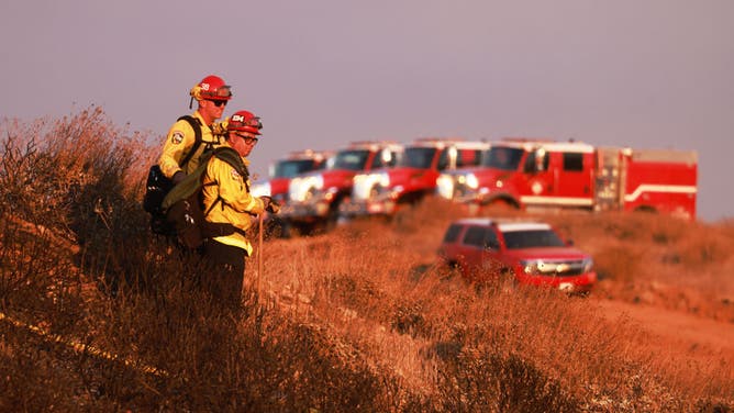 CalFire crews monitor as the Eagle Fire burns in Riverside, California, July 21, 2024.