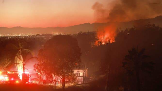 Homes are threated as the Hawarden Fire burns in Riverside, California, July 21, 2024.