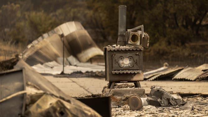 CHICO, CALIFORNIA - JULY 27: An old ranch house is reduced to ash near the small community of Payne Creek as the Park Fire continues to expand on July 27, 2024 near Chico, California. The Park Fire has grown to 348,370 acres and is still 0 percent contained. Strong winds and dried vegetation fueled the fire that exploded 70,000 acres in the first 24 hours after a man allegedly pushed a burning car into a ravine to intentionally set the blaze. In 2018, more than 18,000 structures were destroyed and 85 people killed in the nearby town of Paradise when the Camp Fire entrapped thousand of people and became the deadliest and most destructive fire in California history. (Photo by David McNew/Getty Images)