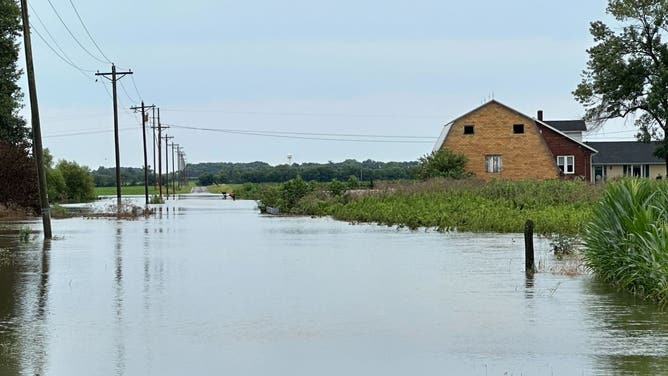 Flooding due to an imminent dam failure in Nashville, Illinois.