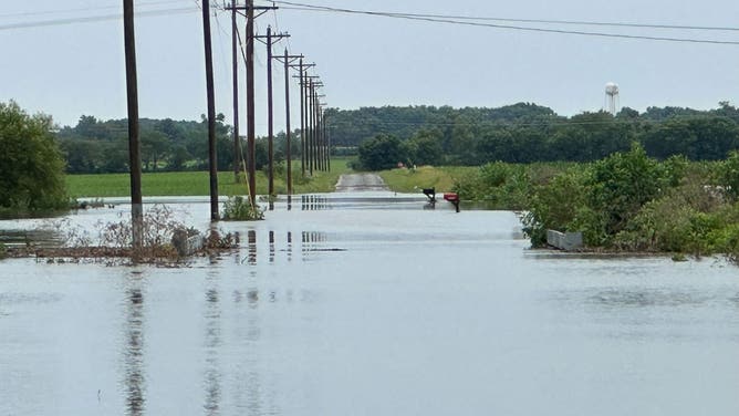 Flooding due to an imminent dam failure in Nashville, Illinois.