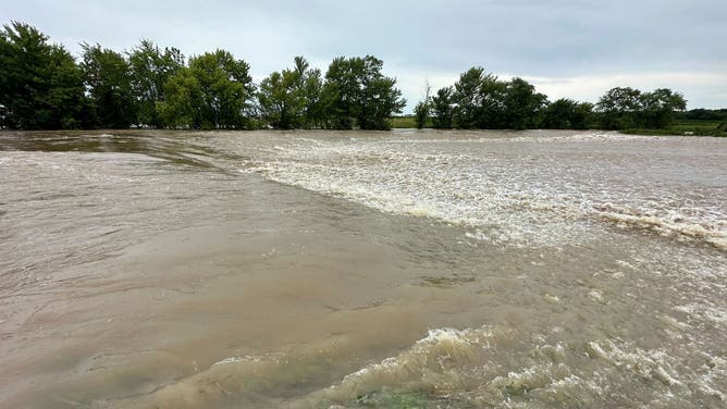 Flooding due to an imminent dam failure in Nashville, Illinois.