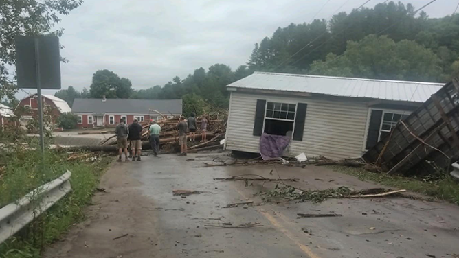 A home is seen on the side of a road after it was washed off its foundation in Lyndon, Vermont, on Tuesday, July 30, 2024.