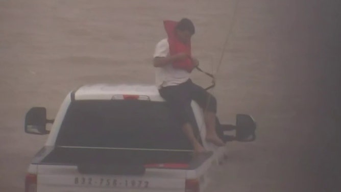 A man was found stranded on the roof of his truck as floodwaters continued to rise in the Houston area on Monday after Hurricane Beryl crashed ashore along the central Texas coast.