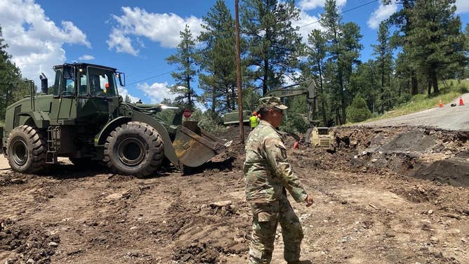 New Mexico National Guardsmen in Ruidoso helping with flood repairs and mitigation.