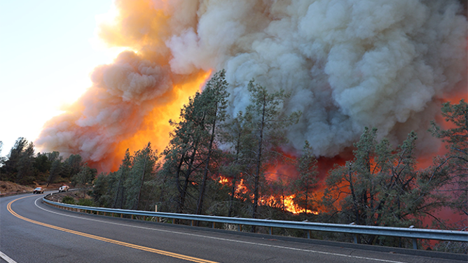 This image shows flames from California’s Park Fire burning near Chico devouring the landscape.