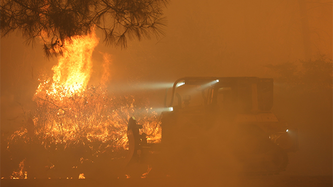 This image shows flames from California’s Park Fire burning near Chico devouring the landscape.