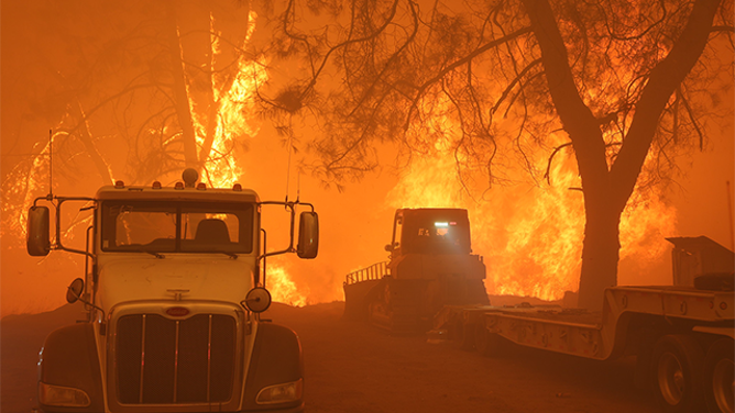 This image shows flames from California’s Park Fire burning near Chico devouring the landscape.