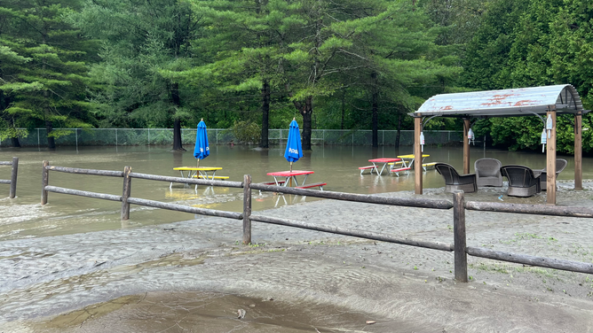 Mud and water in the Tirozzi's Bakery parking lot and outdoor seating area after the July 30 flooding in Vermont.