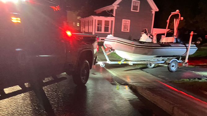 A rescue boat is seen in St. Johnsbury, Vermont, after catastrophic flooding overnight trapped dozens of residents in their homes.