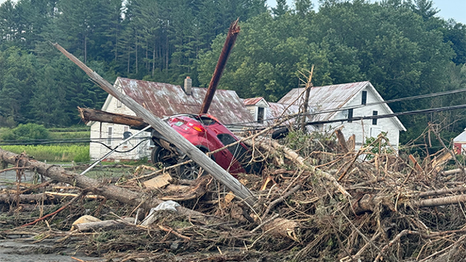 A car is seen among the debris after catastrophic flooding in Lyndonville, Vermont, on Tuesday, July 30, 2024.