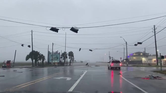 This image shows a traffic light that was brought down from Hurricane Beryl’s powerful winds in Surfside Beach, Texas, on Monday, July 8, 2024.