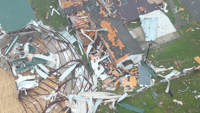 Photos from Mansfield, Louisiana showed damage from a tornado that hit the town on Monday. Several structures appeared to have damage and trees were knocked down onto roadways.