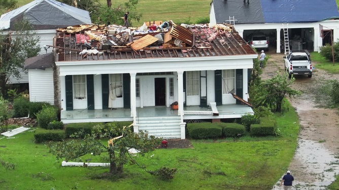 Photos from Mansfield, Louisiana showed damage from a tornado that hit the town on Monday. Several structures appeared to have damage and trees were knocked down onto roadways.