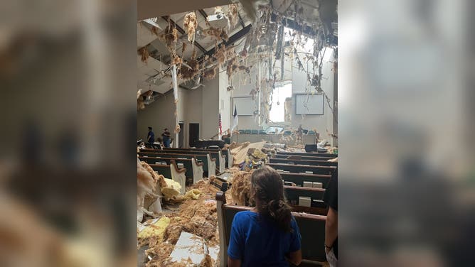 Photos from Mansfield, Louisiana showed damage from a tornado that hit the town on Monday. Several structures appeared to have damage and trees were knocked down onto roadways.