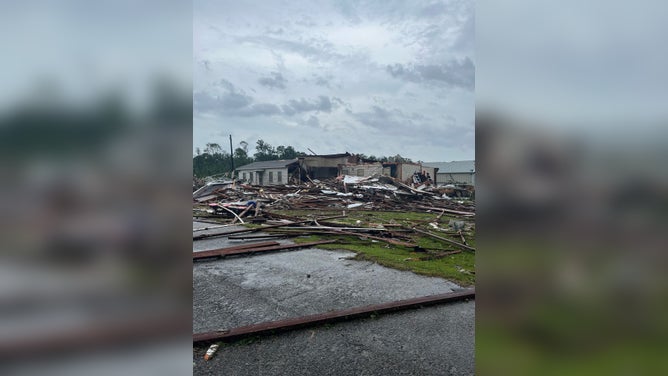 Photos from Mansfield, Louisiana showed damage from a tornado that hit the town on Monday. Several structures appeared to have damage and trees were knocked down onto roadways.