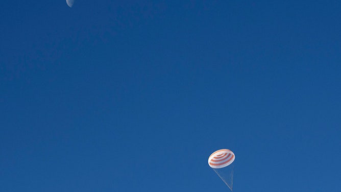 A third quarter moon is seen above the Soyuz MS-11 spacecraft as it lands in Kazakhstan with Expedition 59 crew members in 2019. Anne McClain, David Saint-Jacques, and Oleg Kononenko returned after 204 days onboard the International Space Station.